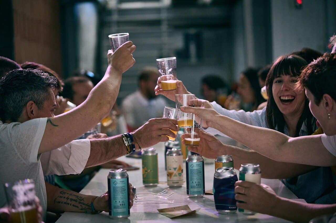 Friends toasting at a brewery event
